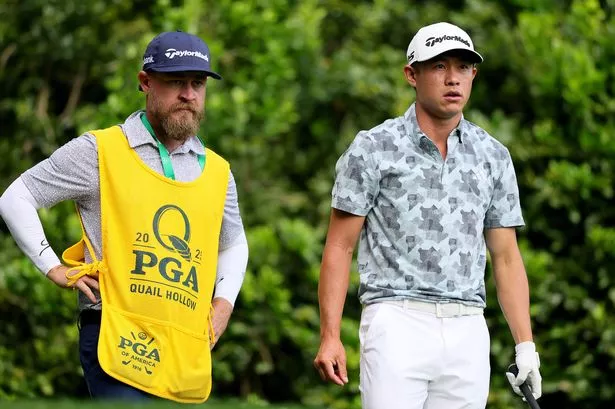 CHARLOTTE, NORTH CAROLINA - MAY 16: Collin Morikawa of the United States talks with his caddie Joe Greiner before hitting a tee shot on the 12th hole during the second round of the PGA Championship at Quail Hollow Country Club on May 16, 2025 in Charlotte, North Carolina. (Photo by Alex Slitz/Getty Images)