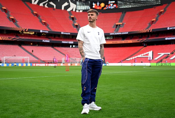 James Maddison inspects the pitch at the San Mames Stadium.