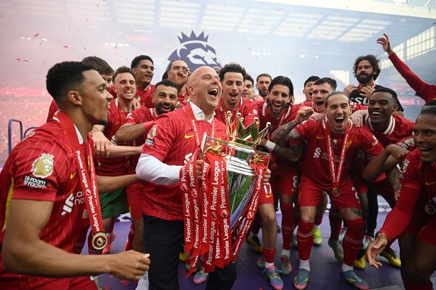 LIVERPOOL, ENGLAND - MAY 25: Arne Slot, Manger of Liverpool,  lifts the Premier League trophy, as Liverpool are crowned the Champions of the Premier League, following the Premier League match between Liverpool FC and Crystal Palace FC at Anfield on May 25, 2025 in Liverpool, England. (Photo by Michael Regan/Getty Images/Getty Images For The Premier League)