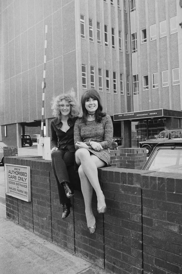 British actresses Polly James (left) and Nerys Hughes, the stars of British sitcom 'The Liver Birds', pose outside the BBC Television Rehearsal Rooms on Victoria Road, London, February 4, 1971