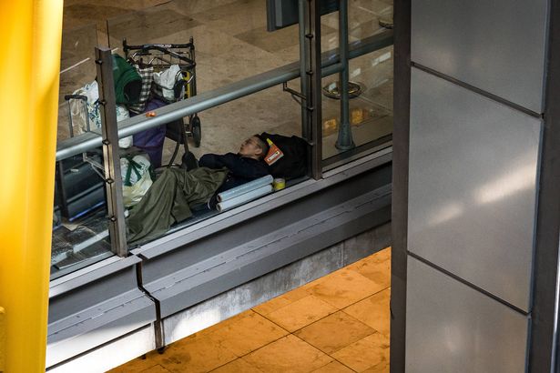 MADRID, SPAIN - MAY 12: A man sleeps in the T4 of the Adolfo Suarez-Madrid Barajas Airport, on 12 May, 2025 in Madrid, Spain. Several hundred homeless people live and sleep in the facilities of the Adolfo Suarez-Madrid Barajas Airport. The complaints of unsafe and unhealthy conditions are causing a confrontation between the City Council of the capital and the regional government against the Executive, through Aena. The trade union Alternativa Sindical Aena/Enaire (Asae) filed a complaint about the existence of insects in Terminal 4 that have caused bites to several workers. (Photo By Diego Radames/Europa Press via Getty Images)