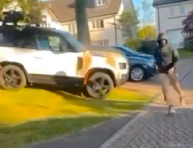 A thug was captured running from the driveway