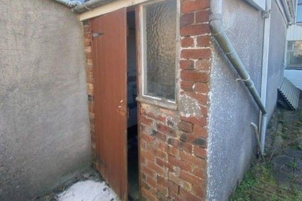 A tiny brick building