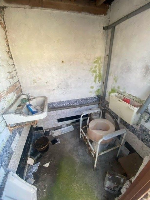 Inside the building and it is a toilet and basin and that's all