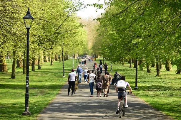 People enjoying a walk in the sunshine in Sefton Park.(Pic Andrew Teebay).
