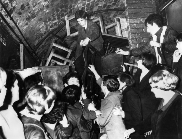 Scene inside the famous Cavern Club in Matthew Street, Liverpool. Tables and chairs destroyed February 1965