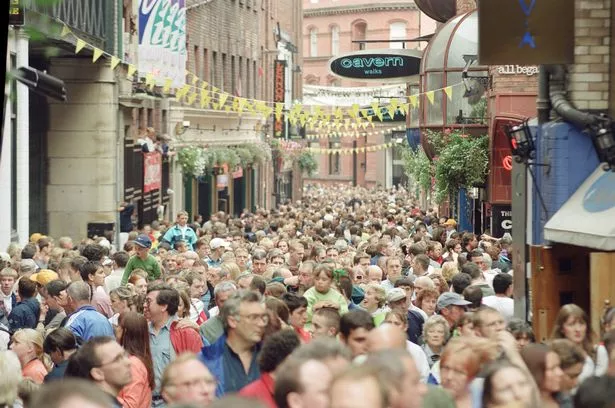 Scenes from The Beatles Weekend. Liverpool, Merseyside.

Fans enjoy a weekend of music, dancing, exhibitions, and socialising, as once again the city
celebrates the music of The Beatles.

Picture shows the crowds of people filling up Mathew Street where The Cavern Club was, and still is.

Picture taken 31st August 1993.