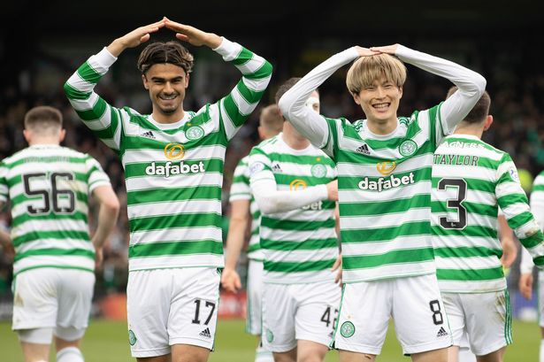 DINGWALL, SCOTLAND - APRIL 24: Celtic's Kyogo Furuhashi (R) celebrates with Jota after making it 1-0 during a cinch Premiership match between Ross County and Celtic at The Global Energy Stadium, on April 24, 2022, in Dingwall, Scotland. (Photo by Alan Harvey / SNS Group)