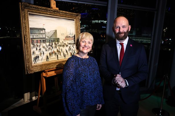 Julia Fawcett, chief executive of The Lowry, with Paul Dennett, Mayor of Salford, and L. S. Lowry's 'Going to the Match' painting.