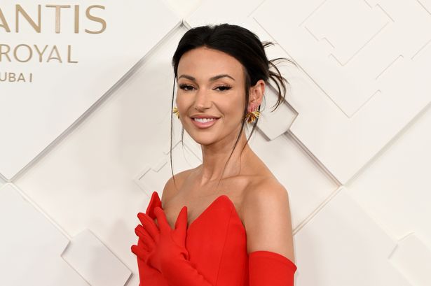 This photo is of Michelle Keegan in a red dress