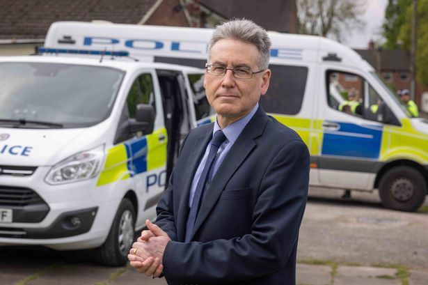 West Midlands Police and Crime Commissioner Simon Foster (pictured with police vehicles in the background) has urged car makers to do more to improve their vehicles' security