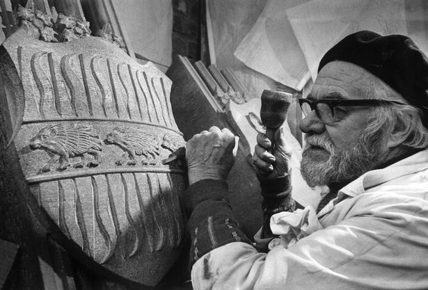 Tom Murphy, a master mason, is pictured with a Coat of Arms which will be painted by Tom once it is in position at Liverpool Cathedral. November 1978.