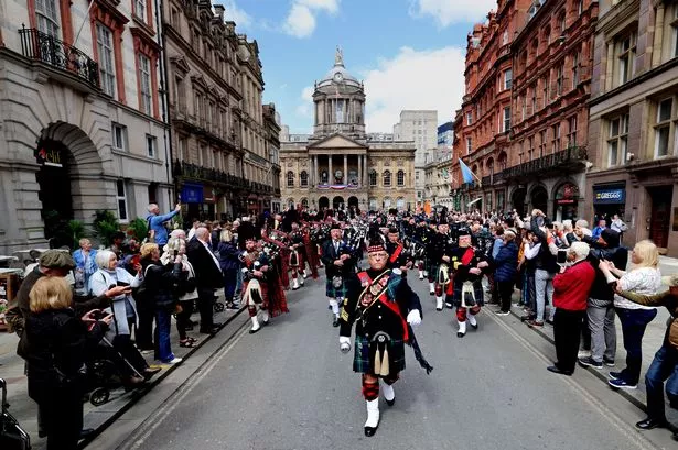 VE Day 80th Anniversary as Liverpool Scottish Regiment accompanied by The Scots Guard and the Wirral Pipe band perform outside Liverpool Town Hall