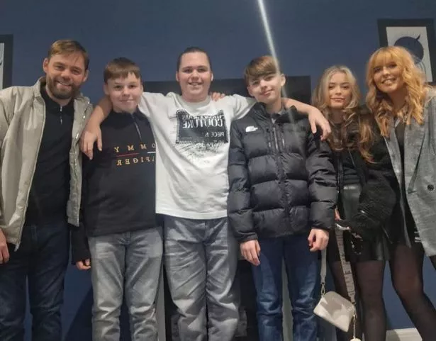 Joseph McManus (left) pictured with his family. Joseph died after collapsing in Benidorm on Friday, May 2