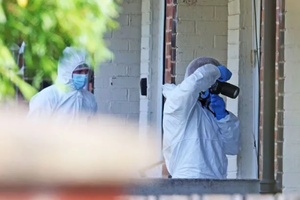 Merseyside Police forensics inspect the scene after a double stabbing on Tobruk Road, Huyton this week