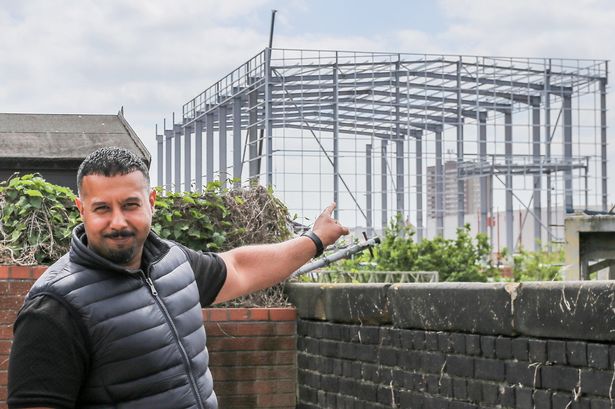 Imran Shaban in his garden.  Nechells in Birmingham on May 15 2025 where a large warehouse unit is being erected near to the Wing Yip Chinese supermarket