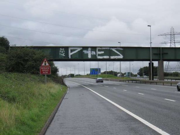 The words 'The Pies' was scrawled in huge letters on the bridge 40 feet over the M58, near Aintree.
 The graffiti on the bridge at the entrance to Switch Island had been there for years. Network Rail has now removed it. April 2011