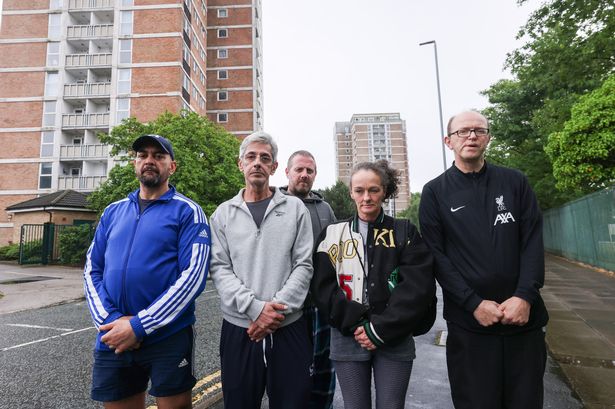 Residents Paul, Hossein Heravi, Phil, Kelly Cox and Chris Penfold-Ivany outside Beech Rise in Kirkby