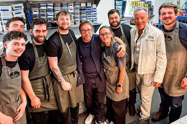 Staff at Norman's Restaurant posed alongside Stephen Graham and Bruce Springsteen