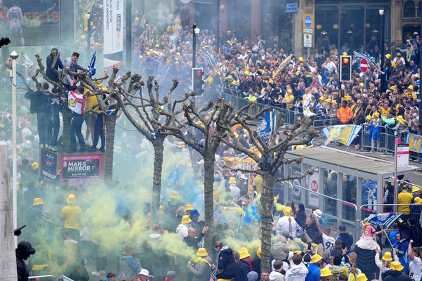 Leeds United fans lining the parade route in the city centre before the Sky Bet Championship trophy parade in Leeds. Leeds United beat Burnley to the title on Saturday.