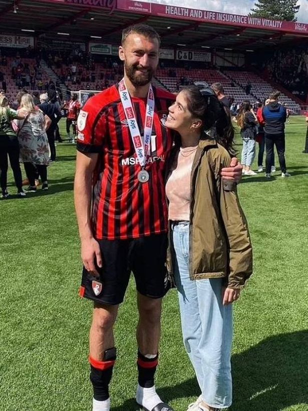 Molly Moorish-Gallagher and Nat Phillips stood on a football pitch together.