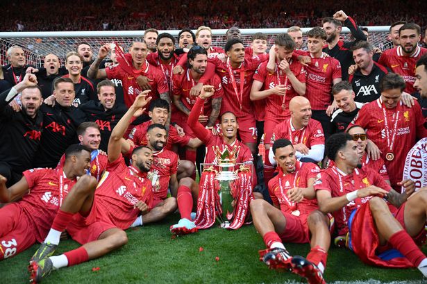Liverpool celebrate with the Premier League trophy after their final game of the season