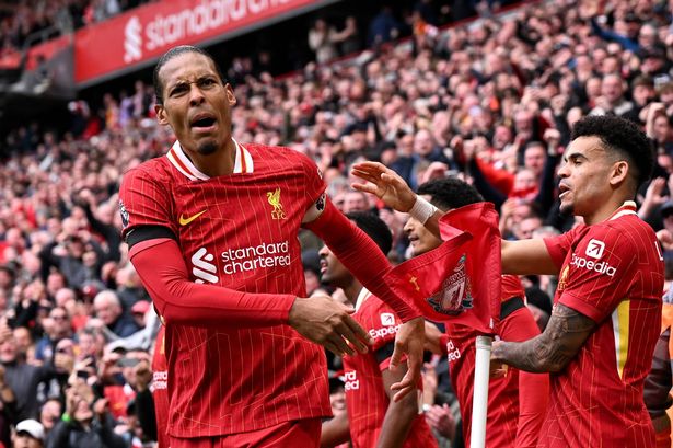 Virgil van Dijk celebrates scoring for Liverpool