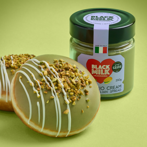 Pistachio Overload Doughnut next to jar of the BLACK MILK spread