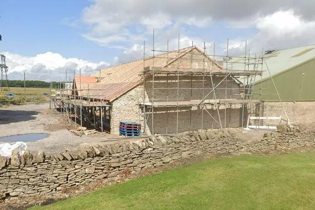 Farm building with scaffolding