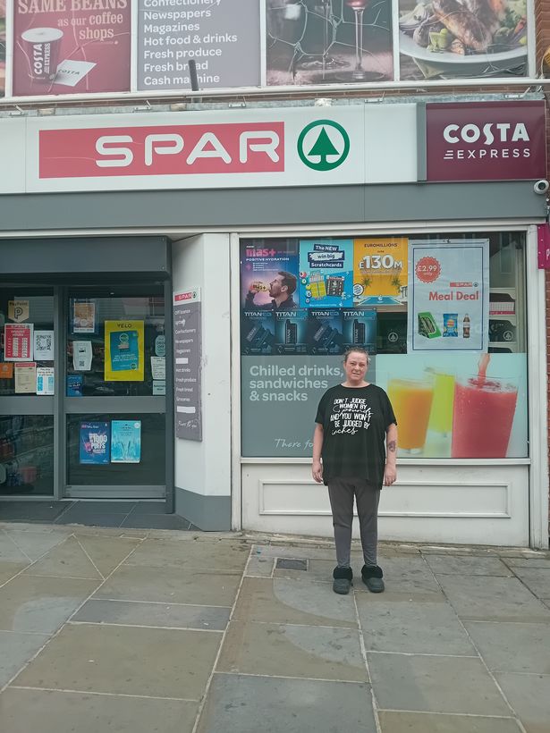 Marie outside one of the shops she used to buy scratch cards from 