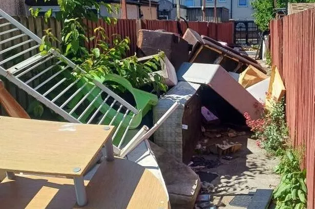Piled up alleyway rubbish in Bootle