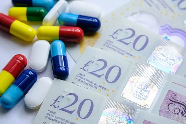 Pills on piles of cash