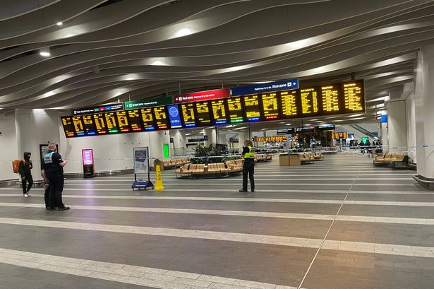 Police cordon surrounds the seating area of the main concourse at New Street station, Birmingham