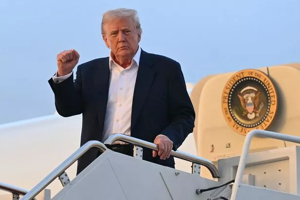 According to the report, the president met the plane in Palm Springs, Florida. 