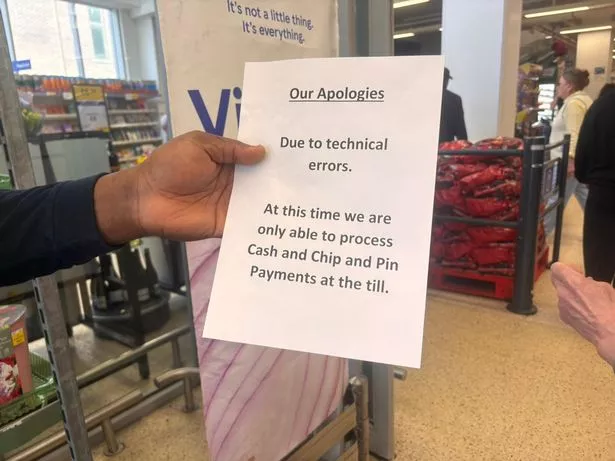 A security guard was holding a sign up to customers at the Tesco store on Hanover Street