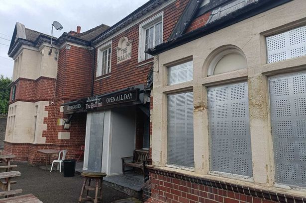 The Bull Inn in Crews Hole, Bristol, has metal shutters on its door and windows