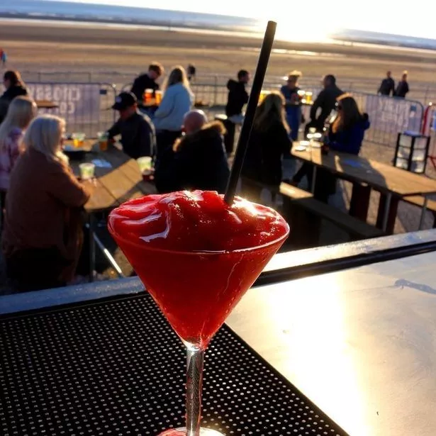 Enjoy a sunset cocktail at The Bus Yard