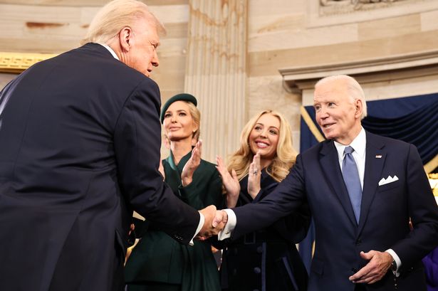 Donald Trump shakes hands with Joe Biden during his inauguration in January