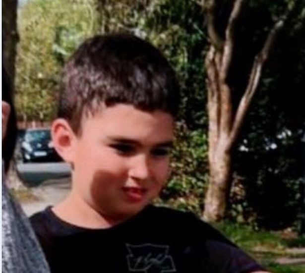 A family photo of Theo who is white with short black or dark brown hair
