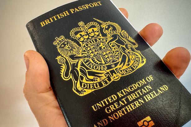 A man holds a post-Brexit United Kingdom issued passport on October 26, 2023 near Bath, England