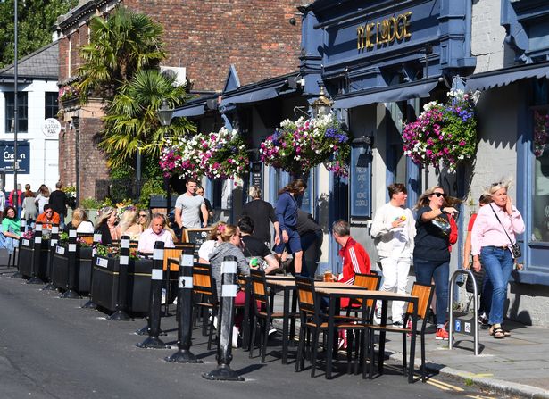 Drinkers outside The Lodge on Lark Lane