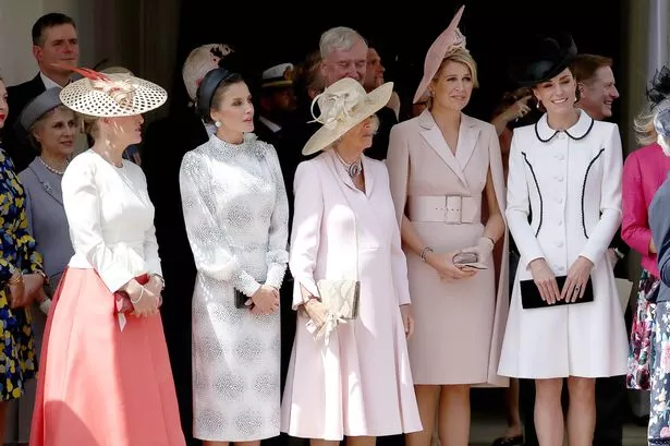 Britain's Sophie, Countess of Wessex (L), Spain's Queen Letizia (2L), Britain's Camilla, Duchess of Cornwall (C), Netherlands' Queen Maxima (2R) and Britain's Catherine, Duchess of Cambridge watch Members of the Order of the Garter process to the ceremony at St George's Chapel at Windsor Castle in Windsor, west of London on June 17, 2019.