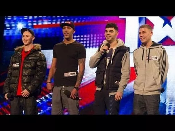 A picture of a boy band singing in BGT