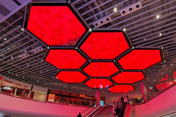 The departure lounge at Terminal 2 has been lit up red ahead of United fans flying out to Bilbao