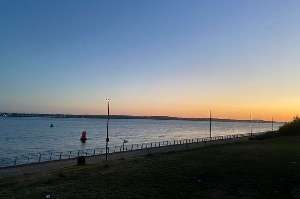 Otterspool Promenade at sunset .