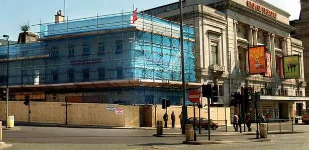 The Legs of Man, surrounded by scaffolding