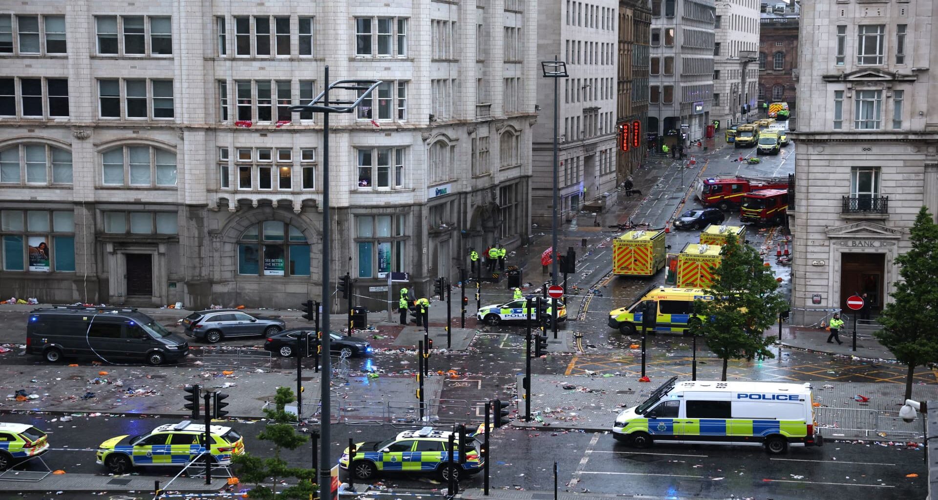 Car collides with pedestrians at parade celebrating soccer win in Liverpool, England
