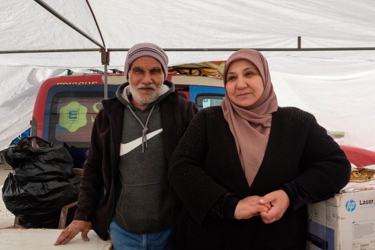 A man standing next to a woman