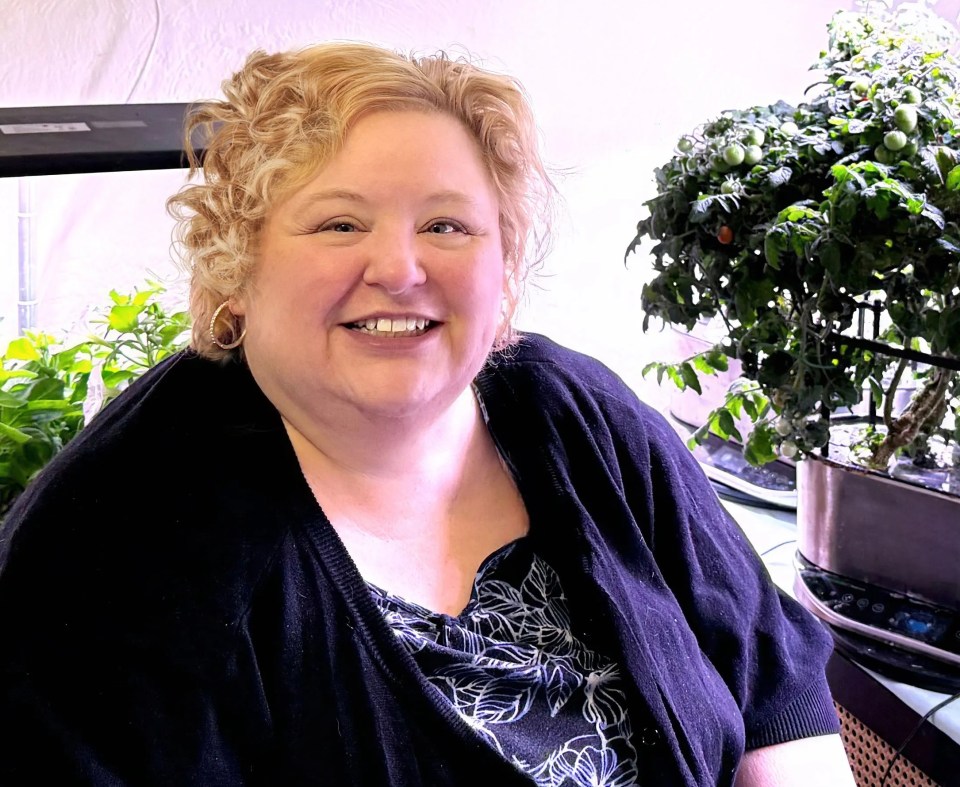 Alaina, a 57-year-old woman from the USA, smiling for a case study.