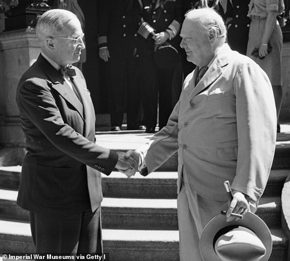 Potsdam Conference, Germany, July 1945, Prime Minister Winston Churchill and US President Harry Truman shake hands on the steps of Truman's residence, 'The White House', at Kaiser Strasse, Babelsberg, Germany, on 16 July 1945. (Photo by Capt. W T Lockeyear/ Imperial War Museums via Getty Images)
